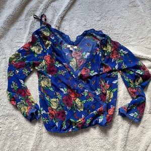 Royal blue floral pattern blouse with lace detail and v neck cut size medium